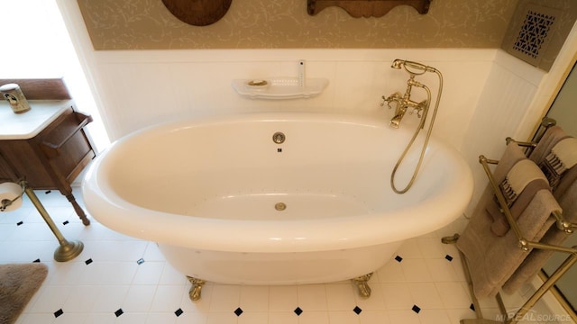 bathroom with tile patterned flooring and a bathing tub