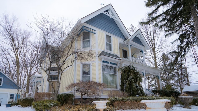 victorian-style house with a balcony