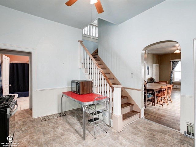 stairway with ceiling fan