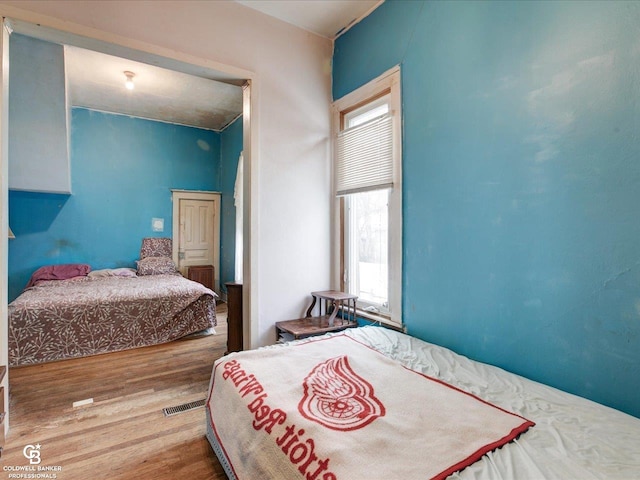 bedroom featuring hardwood / wood-style floors