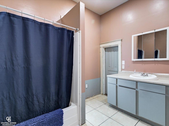 bathroom with vanity, tile patterned floors, and shower / bath combo with shower curtain