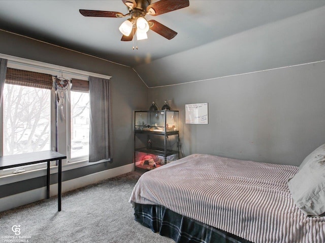 bedroom with lofted ceiling, carpet flooring, and ceiling fan