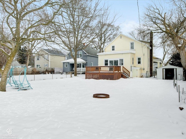 exterior space featuring a wooden deck and a shed