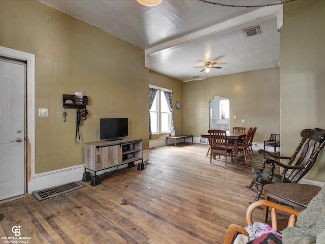 living room with hardwood / wood-style flooring and ceiling fan