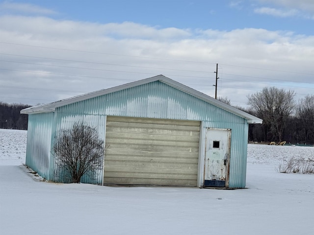 view of snow covered garage