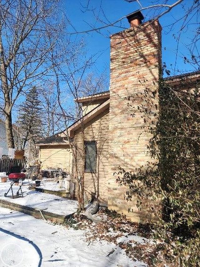 view of snow covered property