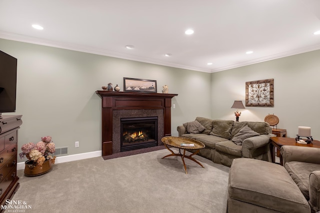 carpeted living room featuring a premium fireplace and ornamental molding