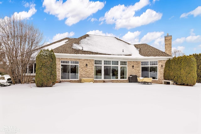 view of snow covered house