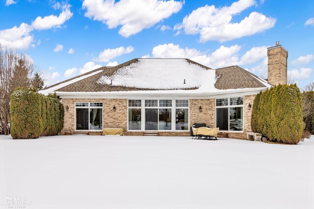 view of snow covered property