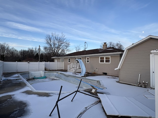 view of swimming pool with a water slide