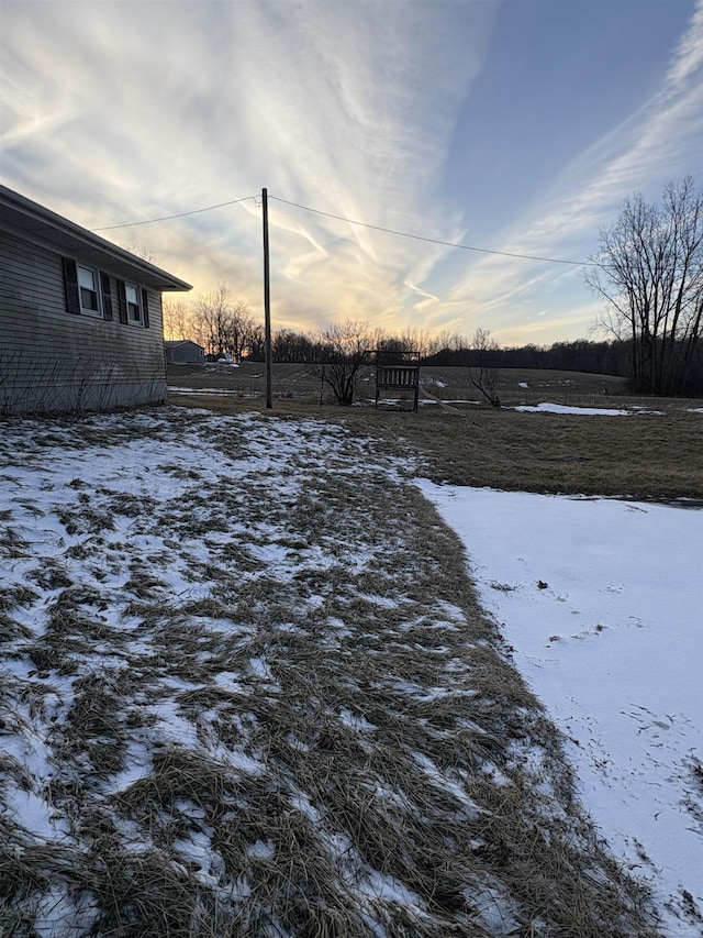 view of yard layered in snow