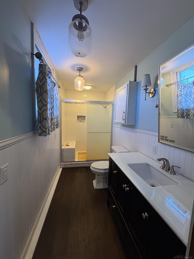 bathroom featuring hardwood / wood-style flooring, vanity, and toilet