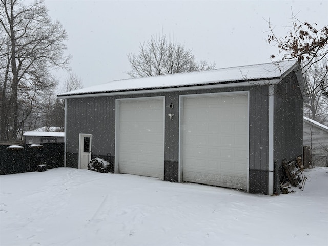 view of snow covered garage