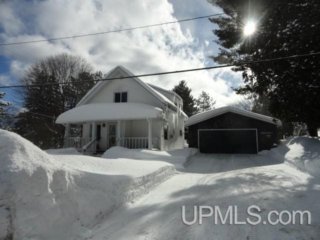 view of front of home with a garage and covered porch