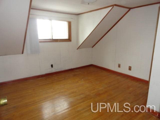 spare room with light wood-type flooring