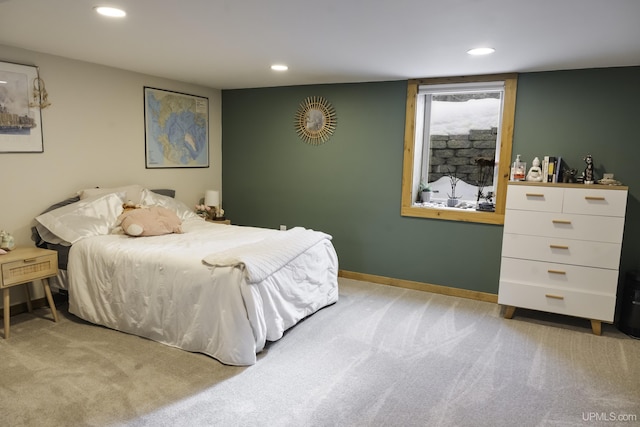 bedroom with light colored carpet