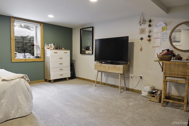 carpeted bedroom with a fireplace