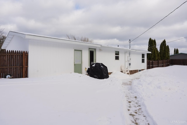 view of snow covered property