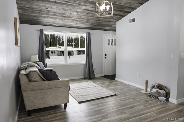 sitting room with lofted ceiling, hardwood / wood-style floors, and wooden ceiling