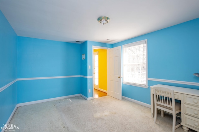 unfurnished office with light colored carpet