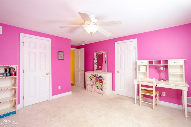 recreation room with ceiling fan and carpet