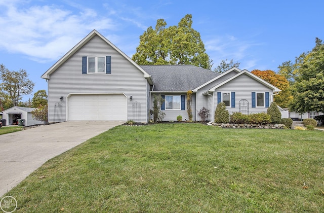 view of front of house featuring a garage and a front yard