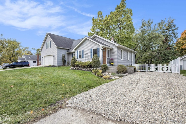 view of front of home featuring a garage and a front lawn