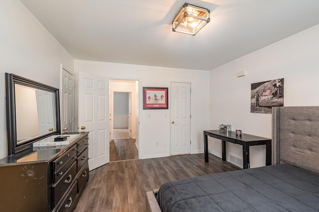 bedroom featuring dark wood-type flooring