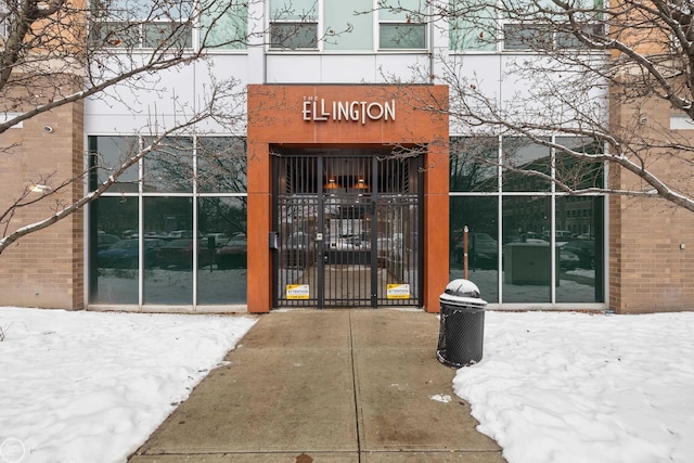 view of snow covered property entrance