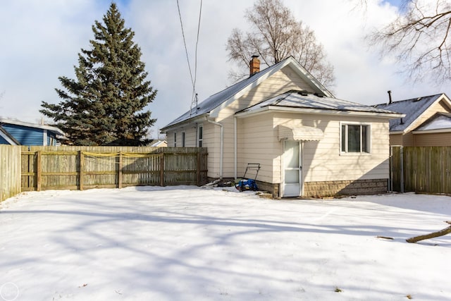 view of snow covered property