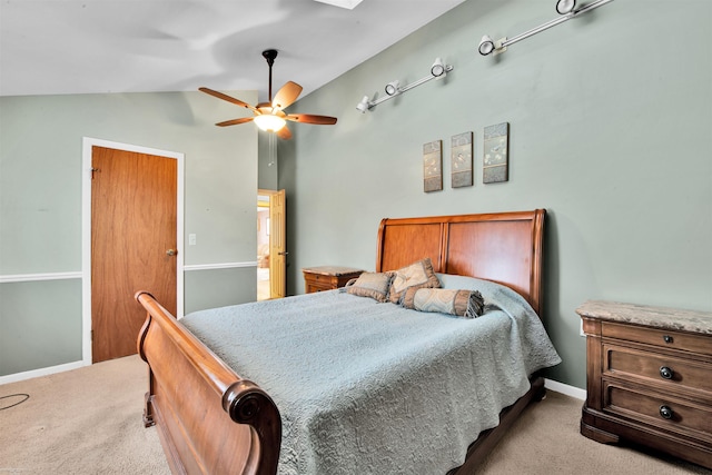 carpeted bedroom featuring lofted ceiling and ceiling fan