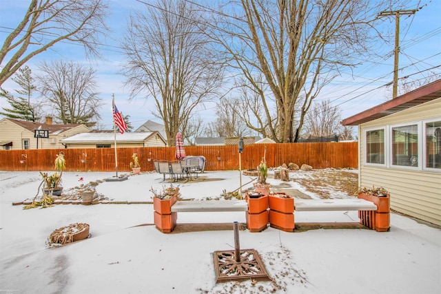 view of yard layered in snow