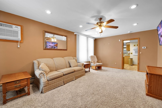 living room with a baseboard radiator, light carpet, a wall mounted air conditioner, and ceiling fan