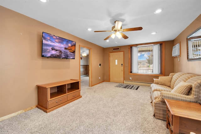 living room featuring a baseboard heating unit, light colored carpet, a wall mounted AC, and ceiling fan