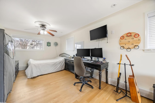 bedroom featuring ceiling fan and light hardwood / wood-style flooring