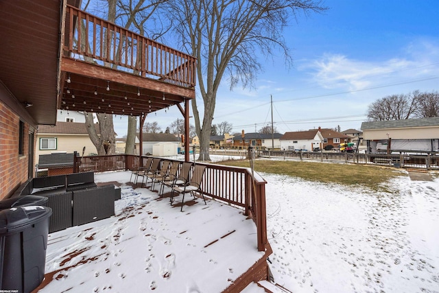 snow covered deck featuring an outdoor living space