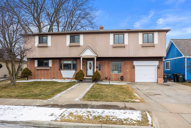 view of front of home featuring a garage and a front yard