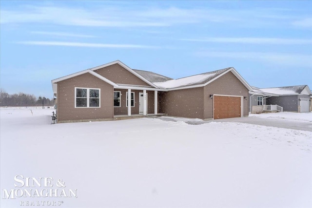 ranch-style house featuring a garage