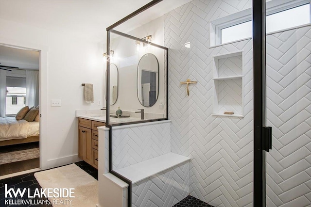 bathroom with tile patterned floors, vanity, and walk in shower