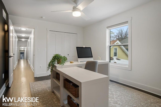 office space featuring ceiling fan and dark wood-type flooring