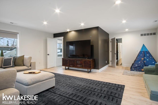 living room with light hardwood / wood-style floors