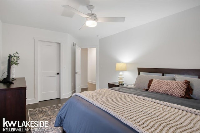 bedroom featuring ceiling fan and dark wood-type flooring