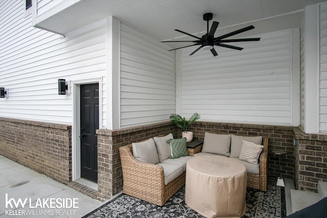 view of patio with an outdoor living space and ceiling fan