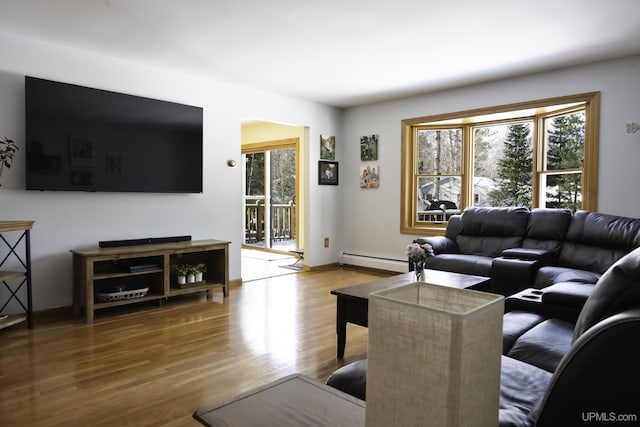 living room with hardwood / wood-style floors and baseboard heating