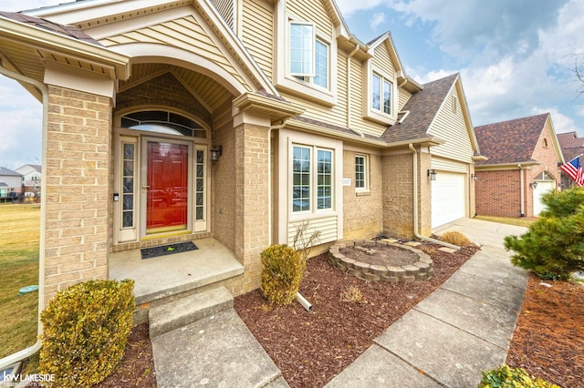 view of exterior entry with a garage