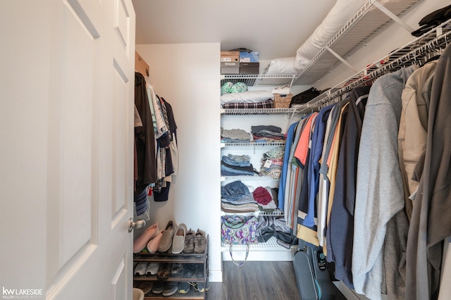 walk in closet with hardwood / wood-style floors