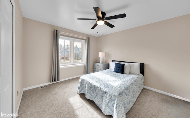 carpeted bedroom with ceiling fan