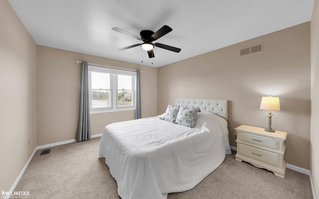 bedroom featuring light colored carpet and ceiling fan