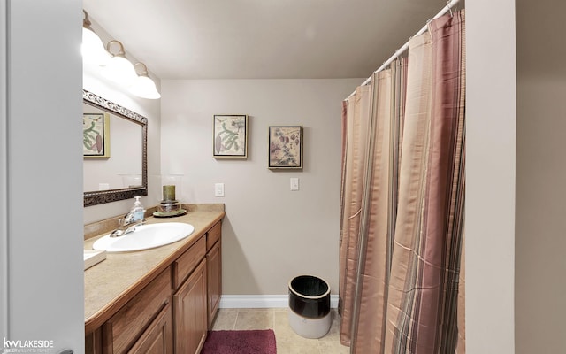 bathroom with tile patterned flooring and vanity