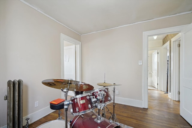 dining area with crown molding and dark hardwood / wood-style floors